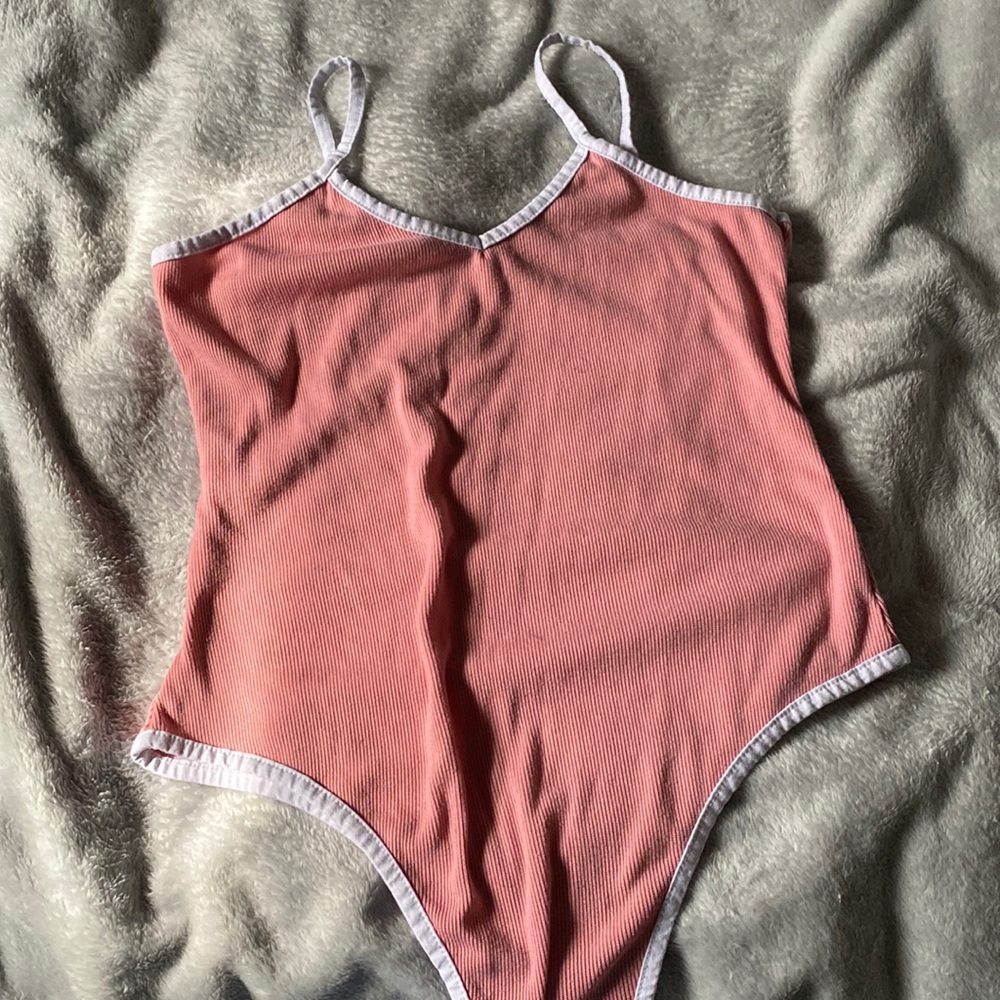 Pink body suit